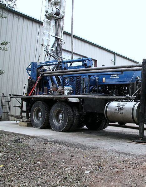 Professional water well drilling rig working at a Christian County property